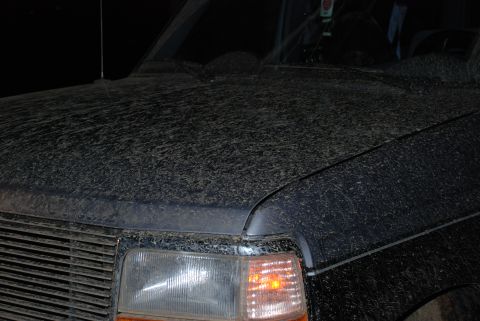 1995 Ford Bronco - Mud covers the hood and front fender of a 1995 Ford Bronco.