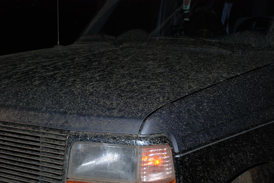 1995 Ford Bronco hood and front fender covered in mud