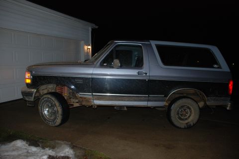 1995 Ford Bronco - This 1995 Ford Bronco is shown from the side, a two-tone gray and black paint scheme.