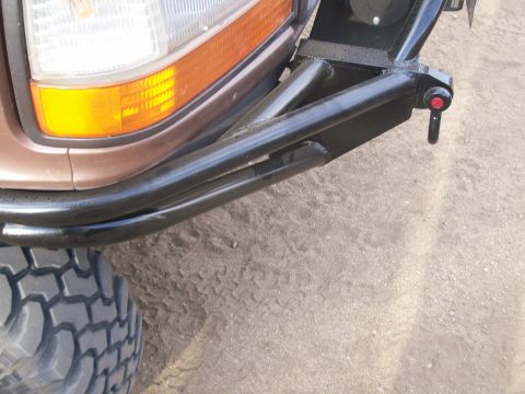 1993 Ford Bronco - A custom tubular bumper is attached to the front of a vehicle, obscuring the original grille and headlight area.