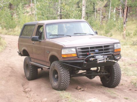 1993 Ford Bronco - This 1993 Ford Bronco features a custom front bumper with an integrated winch, ready for off-road adventures.
