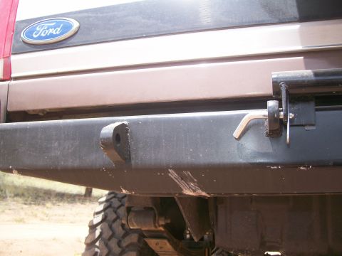1993 Ford Bronco - Close-up of a 1993 Ford Bronco rear bumper, showing a tow hook and an Allen wrench.