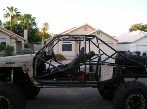 1986 Toyota Hilux - This heavily modified buggy has a custom roll cage and large off-road tires, obscuring its original vehicle identity.
