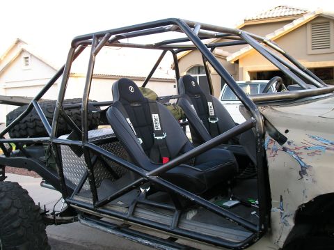 1986 Toyota Hilux - This custom buggy features racing seats and a robust roll cage, built for off-road adventures.