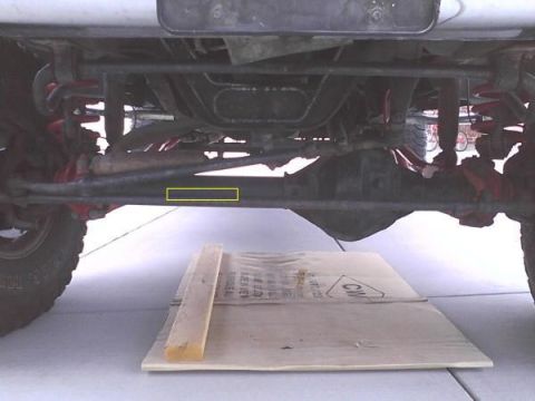 1978 Ford Bronco - Undercarriage view of a vehicle, focusing on suspension and drivetrain components.