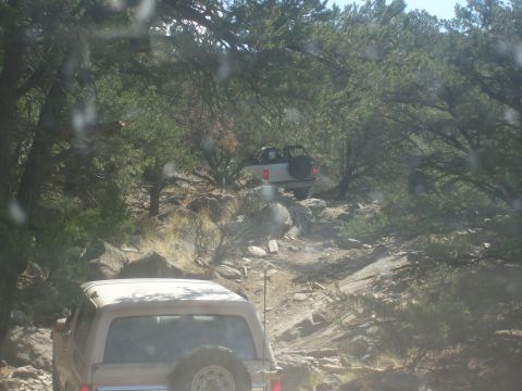 1993 Ford Bronco - Two 1993 Ford Broncos tackle a challenging, rocky trail during an off-road excursion.