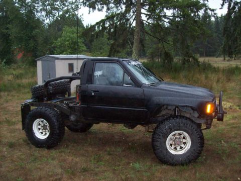1985 Toyota Pickup/SR5 - Modified 1985 Toyota Pickup/SR5 with flatbed and off-road tires.