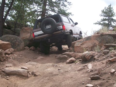 1993 Ford Bronco - This 1993 Ford Bronco tackles a challenging off-road course with steep inclines and large rocks.