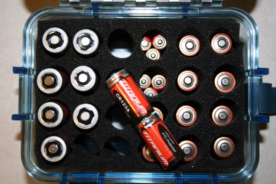 Battery organizer case holding various batteries, including CR123A Titanium batteries