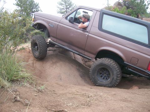 1993 Ford Bronco - This 1993 Ford Bronco is navigating a rocky off-road course with a driver at the wheel.