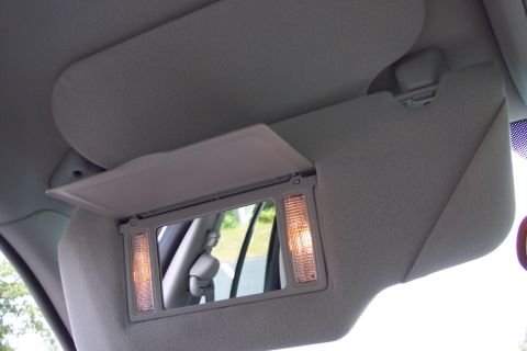 2001 Ford Crown Victoria - Interior view of a car's illuminated vanity mirror.