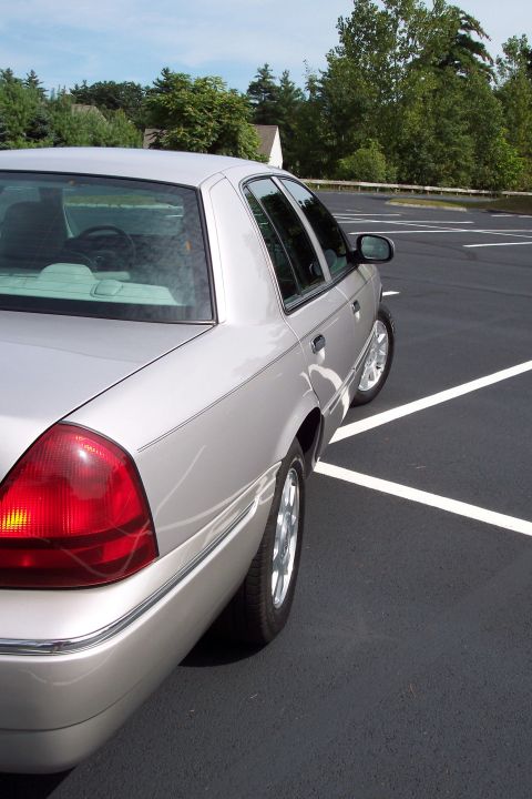 2001 Ford Crown Victoria - This silver sedan's body style suggests a 2004 model year, not a 2001 Ford Crown Victoria.