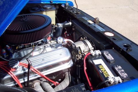 2001 Ford Crown Victoria - The engine bay features a V8 engine with custom chrome accents and red spark plug wires.