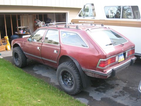 2000 Ford E350 - AMC Eagle wagon modified with a lifted suspension and aggressive off-road tires.