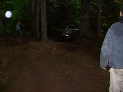 1985 Toyota Pickup/SR5 - A 1985 Toyota Pickup/SR5 is seen off-road in a wooded environment.