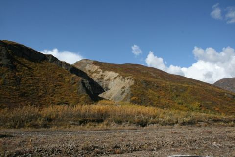 1990 Chevrolet Suburban - A scenic view of a mountain landscape during the fall season, with dry grasses in the foreground.