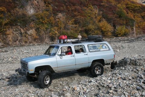 1990 Chevrolet Suburban - This 1990 Chevrolet Suburban is equipped for off-road adventures, seen here on a rocky terrain.