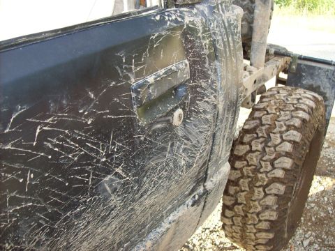 1985 Toyota Pickup/SR5 - This 1985 Toyota Pickup SR5 shows extensive damage and mud from off-road use.
