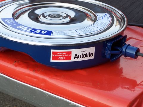 1973 Ford Ranchero - A blue Ford 351-4V air cleaner assembly with an Autolite label is shown resting on a red surface.