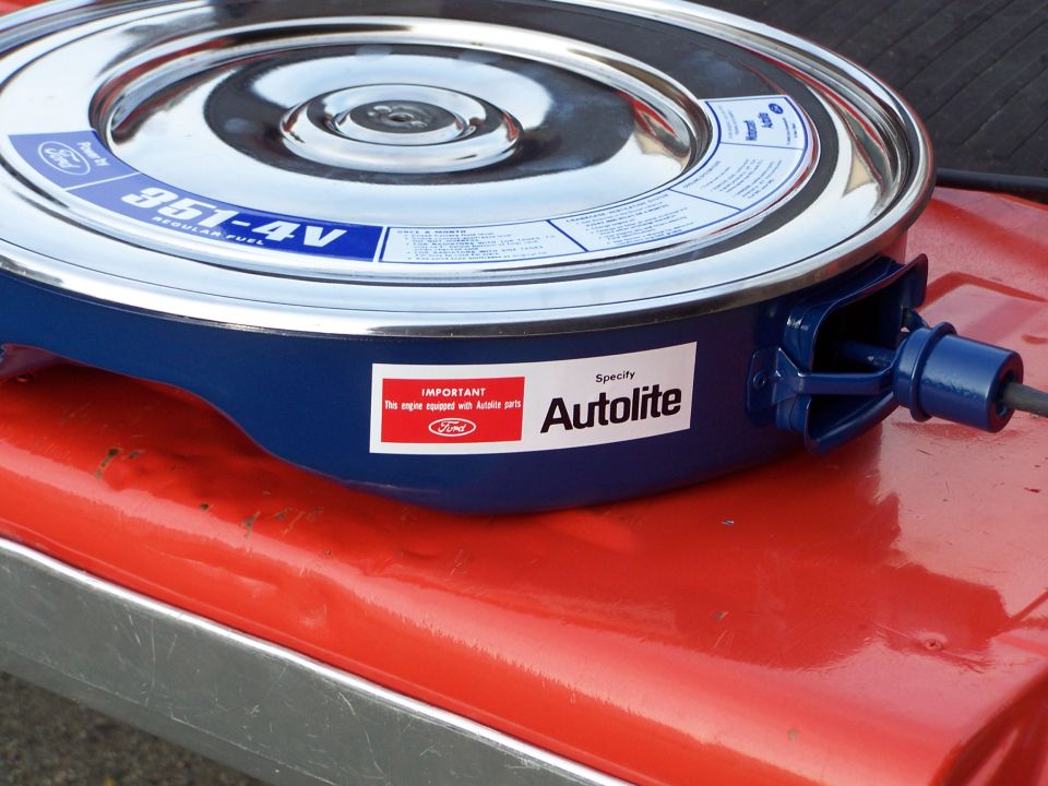 Ford blue 351-4V air cleaner with chrome lid and Autolite decal on a red painted panel