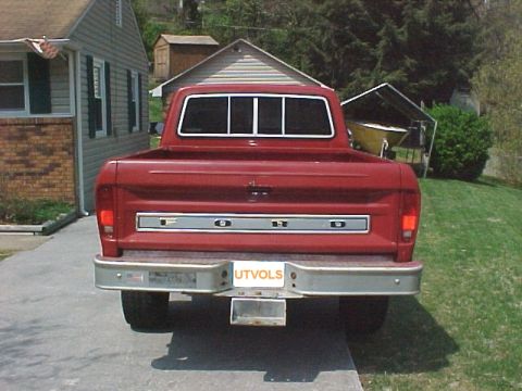 1979 Ford F-150 - Rear view of a red 1979 Ford F-150 pickup truck parked in a driveway.