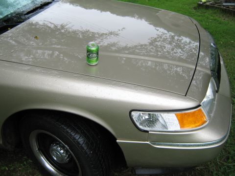 2000 Mercury Grand Marquis - A 2000 Mercury Grand Marquis with a soda can on the hood.