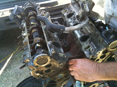 1993 Toyota 4Runner - A close-up view of a disassembled engine, showing internal components like camshafts and intake ports.