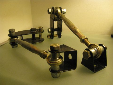 1994 Ford Probe - Close-up of aftermarket suspension components, likely for a performance vehicle, displayed on a flat surface.