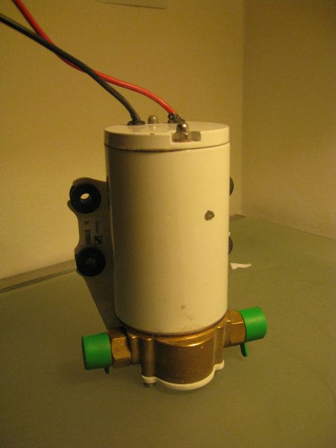 1994 Ford Probe - This appears to be a fuel pump with electrical connections and green fittings.