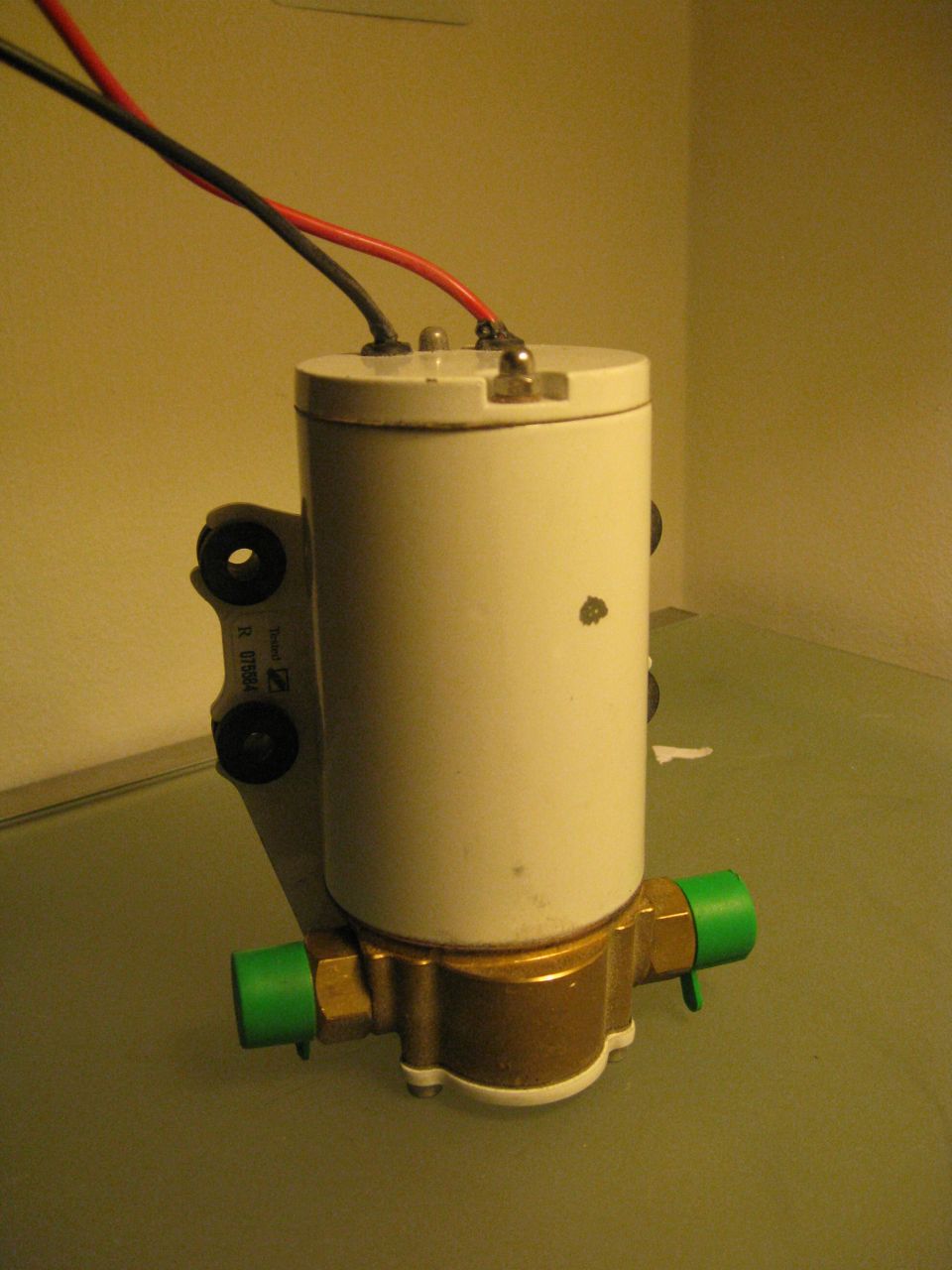 Fuel pump with green fittings and wires