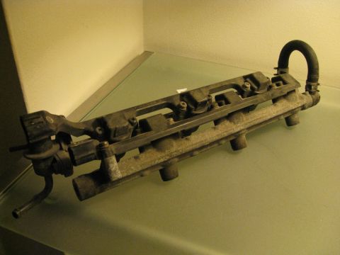 1994 Ford Probe - This is a fuel rail assembly, likely from an engine bay.