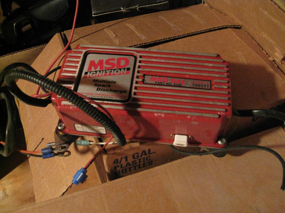 Red MSD Ignition box with "Multiple Spark Discharge" label, part number 6420, serial number 500187. Wires and connectors attached