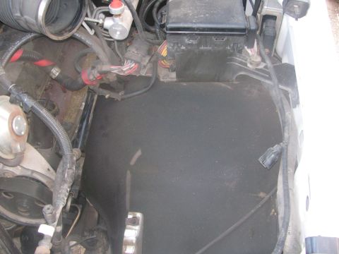 1996 Ford C-350 (Centurion Conversions) - Close-up view of the engine bay, showing the air intake system and fuse box.
