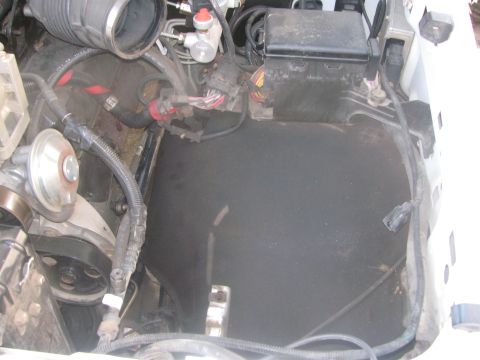 1996 Ford C-350 (Centurion Conversions) - Close-up view of engine bay components including air intake and wiring.