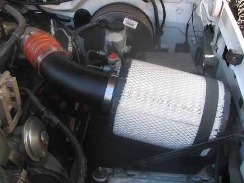 1996 Ford C-350 (Centurion Conversions) - Close-up of an aftermarket engine air intake system, likely a performance upgrade.