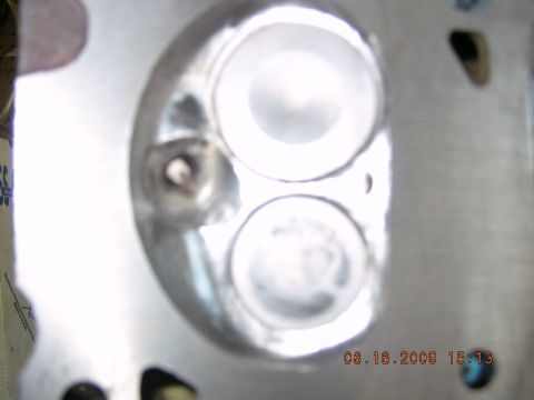 1996 Ford Bronco - Close-up view of an engine cylinder head, showing the intake and exhaust ports.