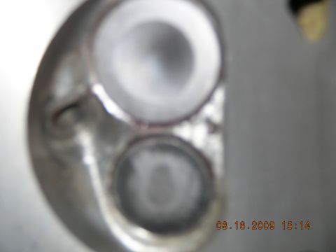 1996 Ford Bronco - Cylinder head with intake and exhaust ports visible, likely from an engine rebuild.