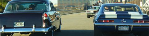 1968 Ford Mustang - Three cars, including a 1969 Camaro and a 1955 Chevrolet, drive down a road.