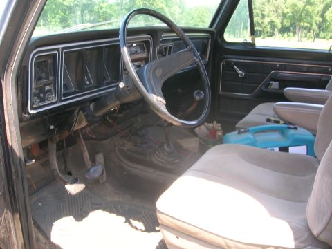1975 Ford F-250 - Interior view of a 1975 Ford F-250, showing the dashboard, steering wheel, and seating area.