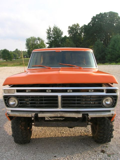1975 Ford F-250 - Front view of an orange 1975 Ford F-250 pickup truck with the hood open.