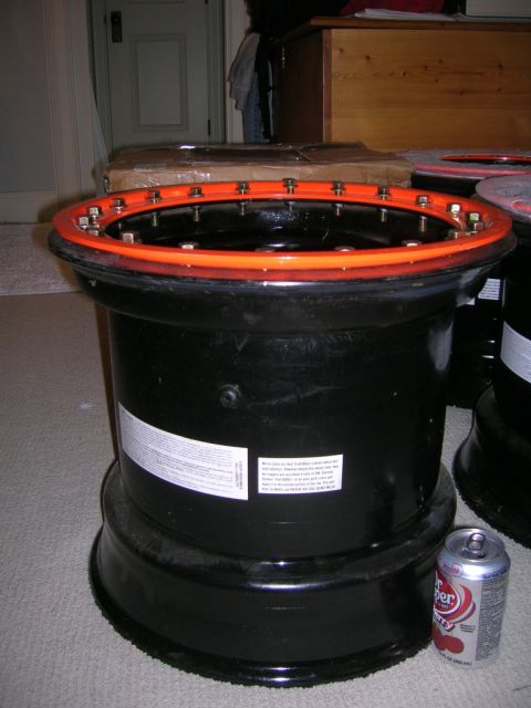 1975 Ford F-250 - A black wheel with an orange beadlock ring is shown with a Dr Pepper can for scale.