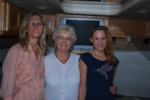 1996 Ford Bronco - Three women pose for a photo inside a recreational vehicle, with a television mounted on the wall behind them.