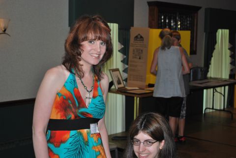 1996 Ford Bronco - Attendees mingle at a reunion event, with informational displays and tables set up in the background.