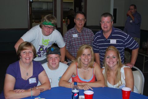 1996 Ford Bronco - A group of people smile for a photo at a reunion event.