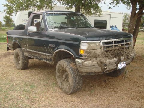 1992 Ford Bronco - This 1992 Ford Bronco is heavily caked in mud after an off-road excursion.