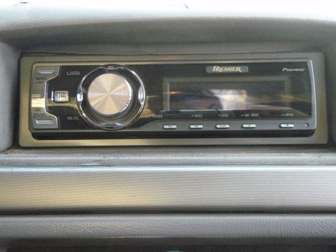 1995 Ford Bronco - A close-up view of a car's dashboard reveals a Pioneer Premier stereo system with a USB input.