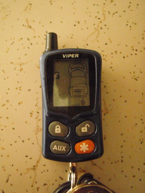 1995 Ford Bronco - Viper alarm remote with lock and unlock buttons, and an AUX button.