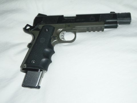 1995 Ford Bronco - A Springfield Armory pistol is shown against a white background.