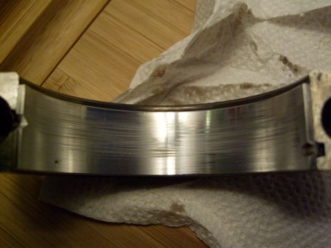 1972 Ford Ranchero - This engine bearing shows significant wear and scoring, indicating a potential mechanical issue.