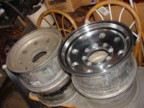 1985 Ford F-150 - Two aluminum truck rims are shown, one with a polished finish and the other showing signs of wear.